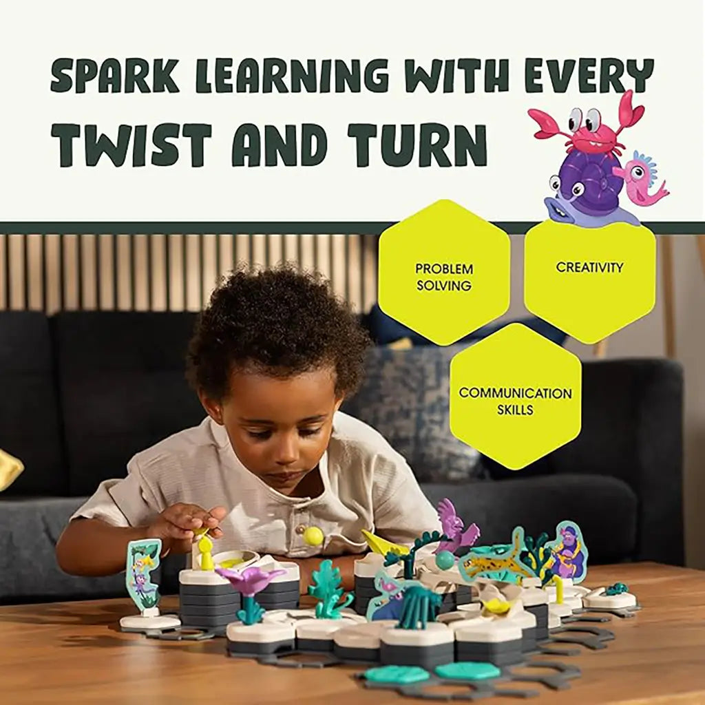 GraviTrax Junior Ocean Starter Set shown with a child exploring the underwater-themed track, promoting problem solving, creativity, and communication skills through play.