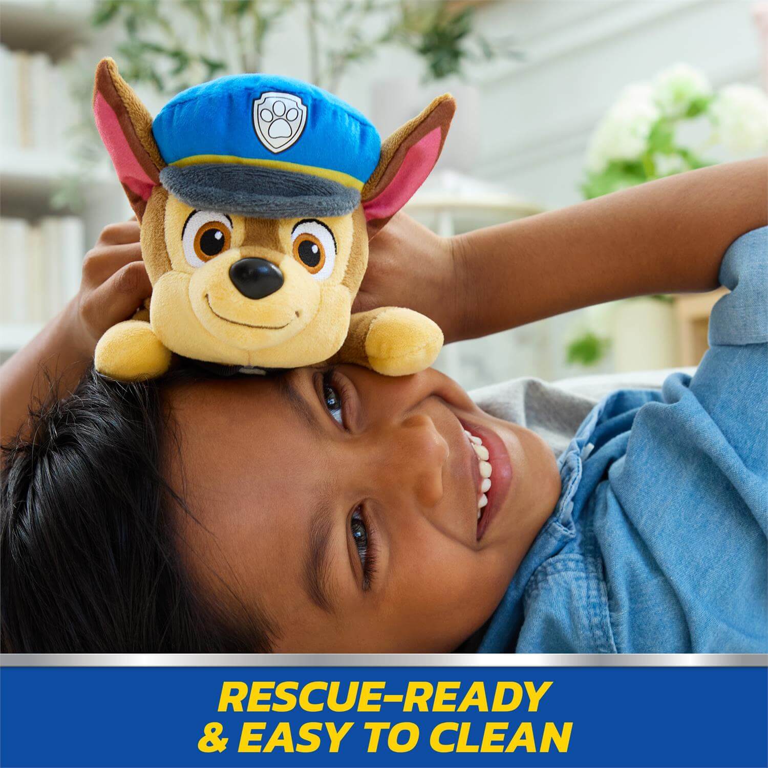 Gund Chase Lounging 8-Inch Plush sitting on childs face
