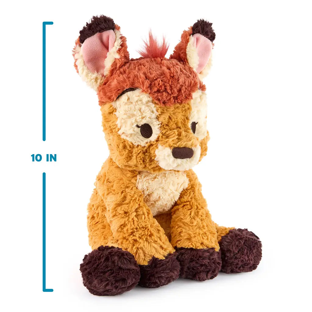 GUND Cozys Disney Bambi plush in warm tan, cream, and rust textured fabric with a rounded seated shape, shown with a measurement graphic indicating 10 inch height to highlight compact size for cuddling, gifting, and shelf display.