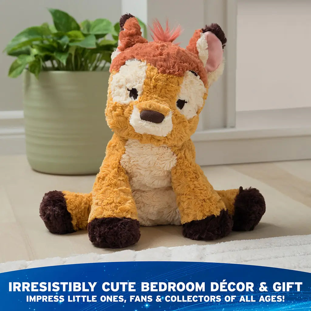GUND Cozys Disney Bambi stuffed animal in golden brown plush with soft wavy texture and floppy limbs, seated on a light floor near home décor to emphasize cozy nursery styling and gentle everyday companionship.
