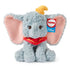 Disney Dumbo plush toy in pale blue with fluffy textured fabric, rounded seated body, floppy limbs, oversized pink ears, yellow hat, and red collar, presented on a white background as a 10-inch under-stuffed, squishy plush.