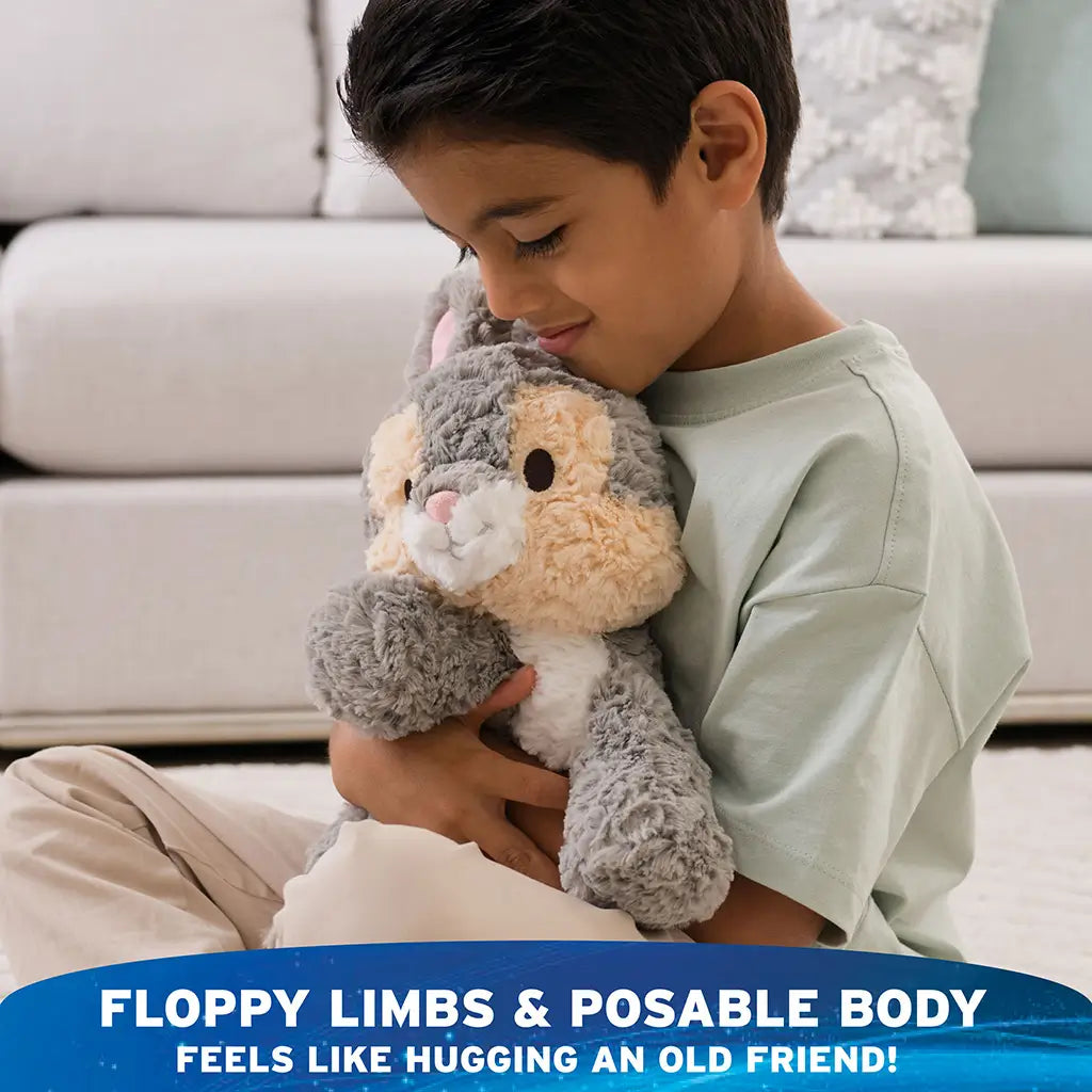 GUND Cozys Disney Thumper stuffed animal in gray and cream tousled plush with floppy limbs and a gently under-stuffed, posable body, designed for imaginative play, comforting hugs, and relaxed seated positioning.