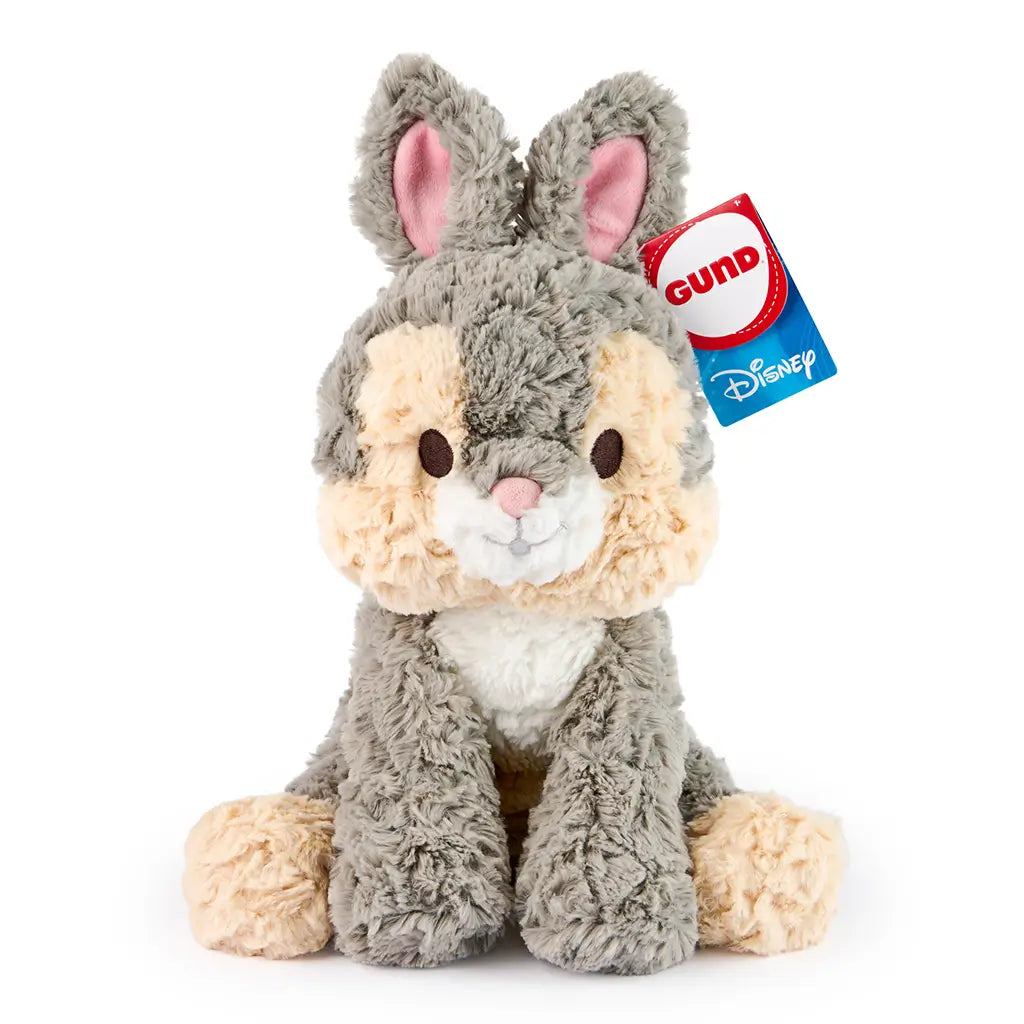 GUND Cozys Disney Thumper plush in soft gray and cream high-pile fabric with a rounded seated shape, velvety pink-lined ears, and floppy limbs, photographed on a white background as a cuddly 10 inch collectible toy.
