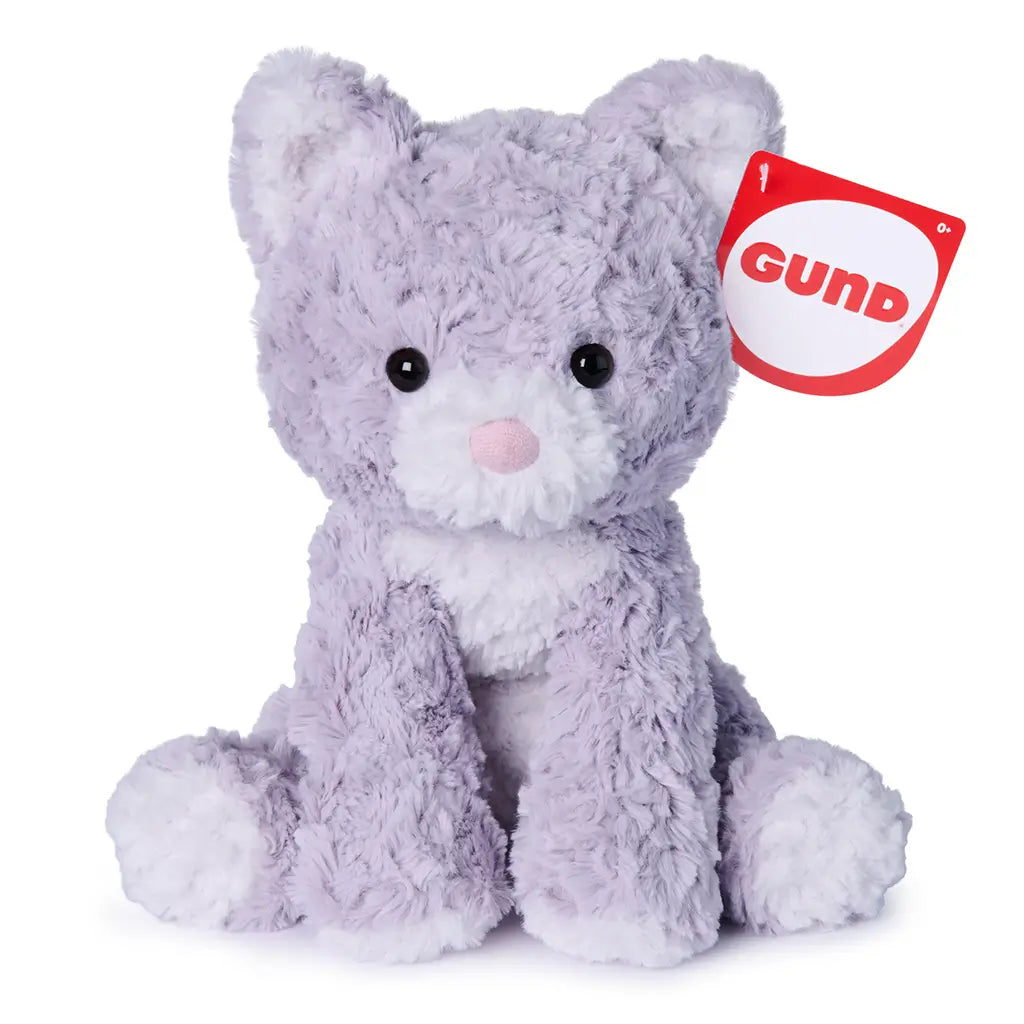 GUND Cozys Kitten plush toy in lavender polyester fabric with fluffy texture and rounded seated shape, shown on a white background with a branded hang tag to highlight authentic GUND quality and gift-ready presentation.