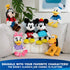 Disney classic character plush collection displayed on a sofa, featuring Daisy Duck alongside Mickey Mouse, Minnie Mouse, Donald Duck, Goofy, and Pluto in soft plush fabrics for themed playtime or display.