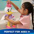 Disney Daisy Duck plush shown in lifestyle scene with a child holding the toy, featuring soft white plush fabric, pink bow and shoes, lavender shirt, and friendly character expression for imaginative play.