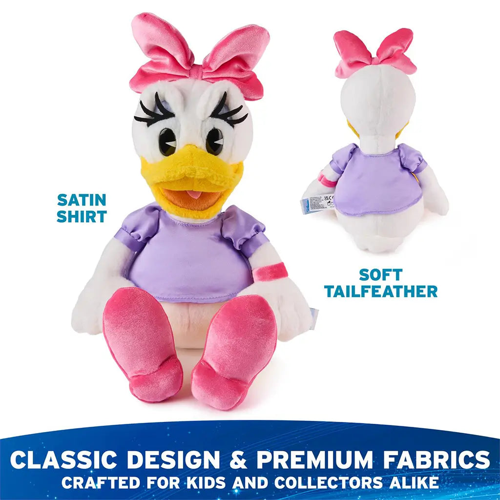 GUND Disney Daisy Duck plush highlighting premium fabrics, showing white plush body, smooth lavender satin shirt, soft pink bow and shoes, yellow beak, and detailed embroidery designed for kids and Disney collectors alike.