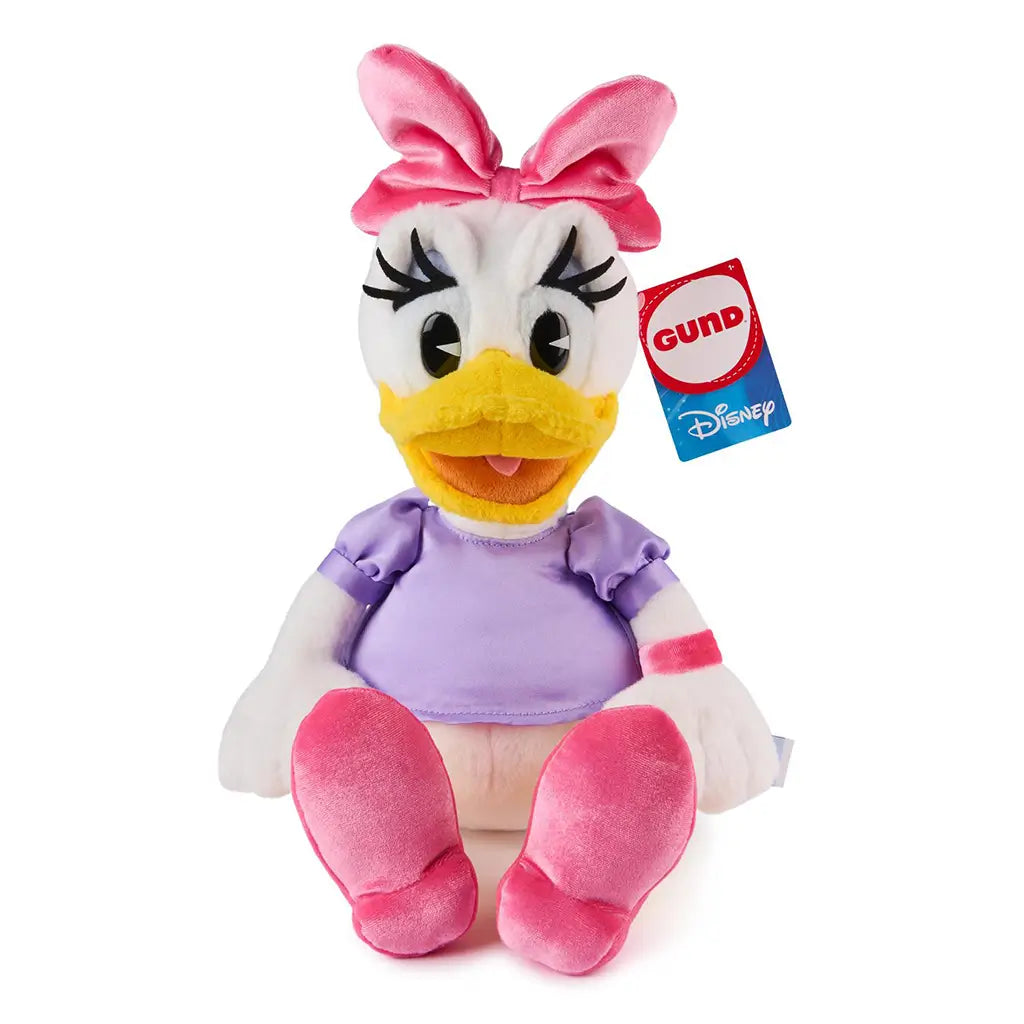 Disney Daisy Duck plush by GUND shown seated against a white background, featuring soft white plush fabric, yellow beak, oversized embroidered eyes, pink bow and shoes, lavender satin shirt, and premium stuffed construction.
