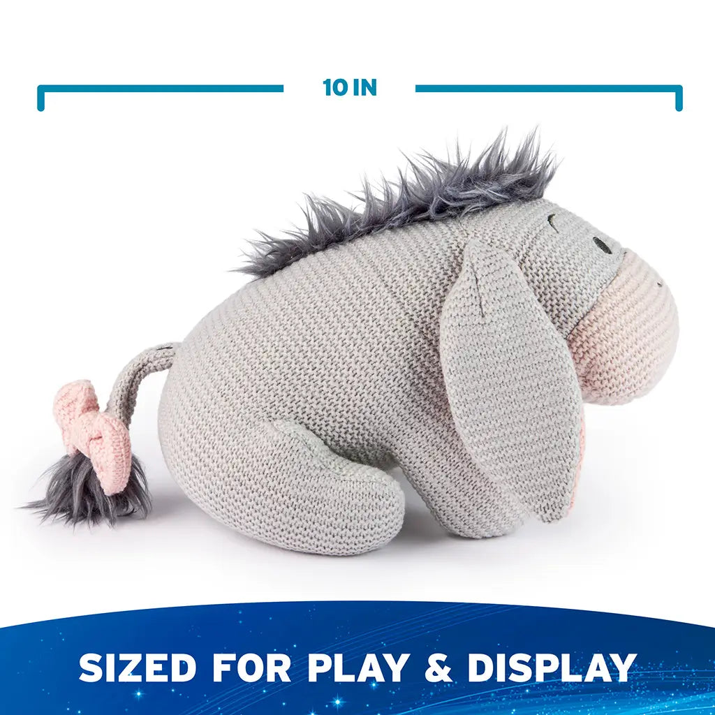 Disney Eeyore plush includes a 10-inch length measurement, featuring a compact knit body, rounded proportions, and lightweight construction sized for play, cuddling, and shelf display.