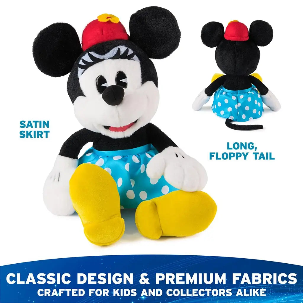 Disney Minnie Mouse plush toy in black and white premium fabric with smooth fuzzy texture, classic seated mouse form, blue satin polka dot skirt, red hat with yellow flower, white gloves, and long floppy tail, shown front and back on white.