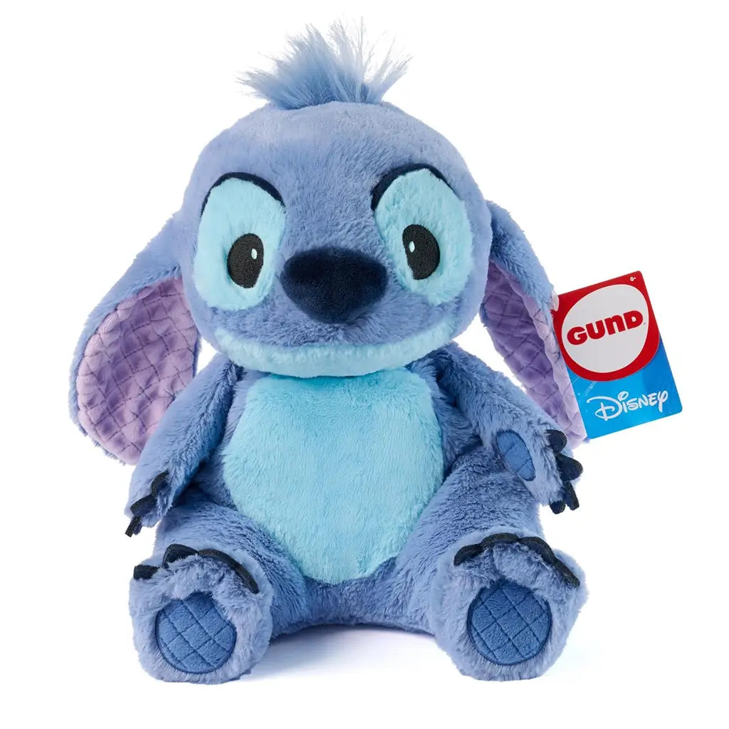 GUND Disney Stitch plush in light blue and lavender fabric with quilted ear lining, rounded form, and embroidered features, created for snuggling, photographed upright against a clean white background.