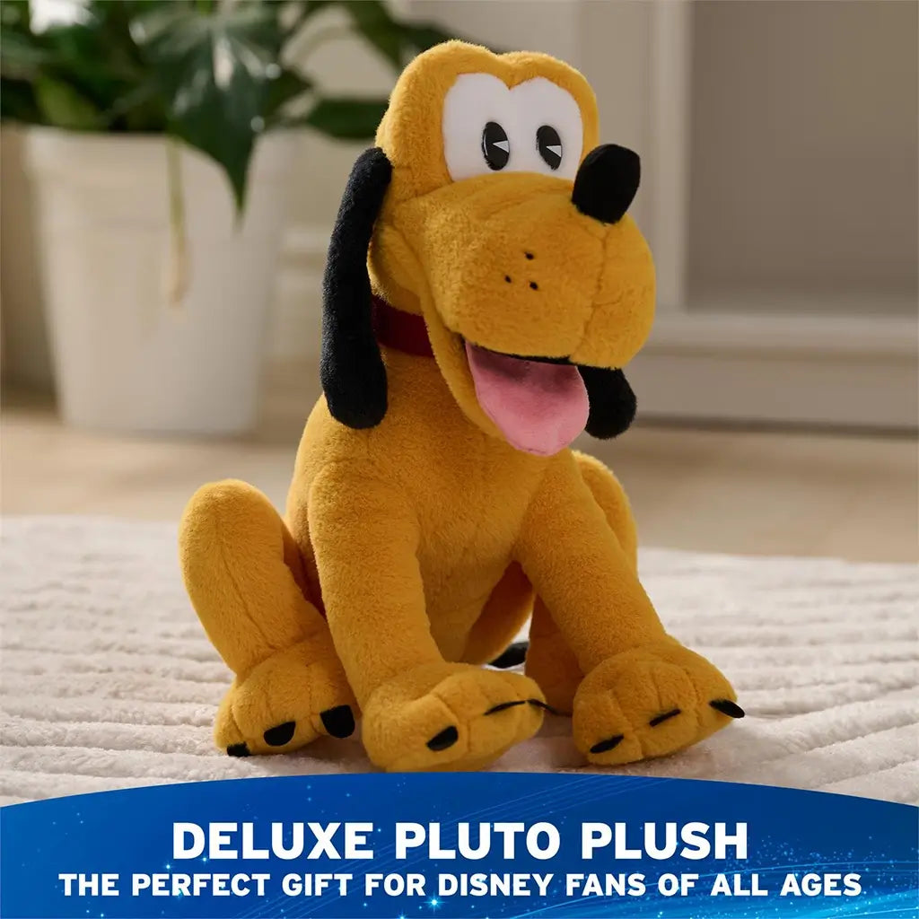 Disney Pluto plush in golden yellow soft fabric with rounded seated dog form, floppy black ears, pink tongue, and red collar, staged on a carpeted floor in a home setting as a deluxe gift plush.