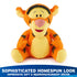 Disney Tigger plush presents a sophisticated homespun look with textured orange knit yarn, soft yellow muzzle and belly, embroidered smile, and relaxed seated posture suited for gifting or display.