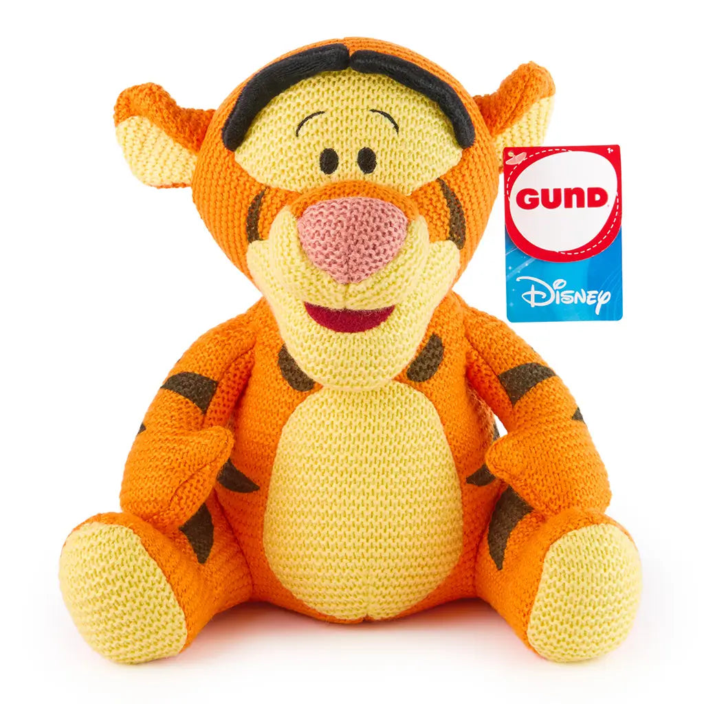 Disney Tigger knit plush features bright orange chunky-knit fabric with yellow accents, rounded seated shape, stitched facial details, and soft striped pattern, designed for cuddly play or cheerful nursery decor.
