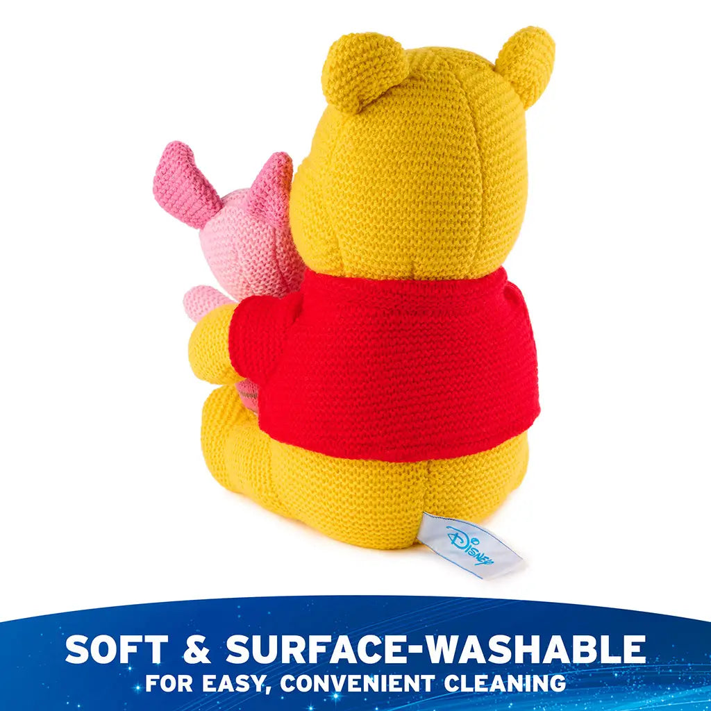 Disney Winnie the Pooh and Piglet knit plush is shown from the back, featuring yellow knit fabric, red shirt detail, attached Piglet companion, and a soft surface-washable design for easy cleaning.