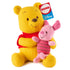 Disney Winnie the Pooh plush holds Piglet in a soft embrace, showcasing yellow and blush knit textures, rounded limbs, stitched facial details, and a classic seated pose made for gentle cuddling.