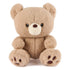 GUND Kai plush teddy bear in light beige fuzzy fabric with rounded shape and paw details, front-facing stuffed toy with embroidered eyes and nose, isolated on a white background
