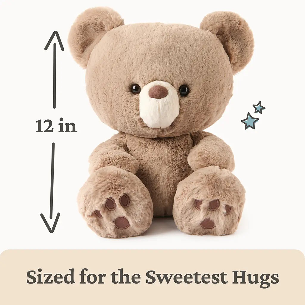 GUND 12-inch teddy bear size guide showing beige plush fabric, soft rounded body shape, and stitched paw pads, with measurement arrows indicating the bear’s cuddly height designed for comforting hugs and play.