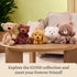 GUND plush teddy bears collection displayed in soft neutral colors, made from velvety polyester fabric with rounded shapes, showcasing the Forever Friends line on a wooden table in a cozy home nursery setting.