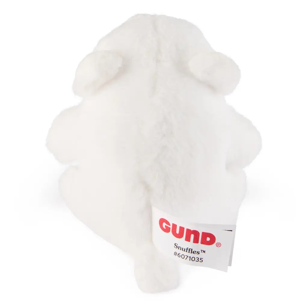 white plush teddy bear GUND toy, soft fuzzy fabric, rounded back view showing smooth texture and stitched seams, with branded fabric tag visible against a plain white background