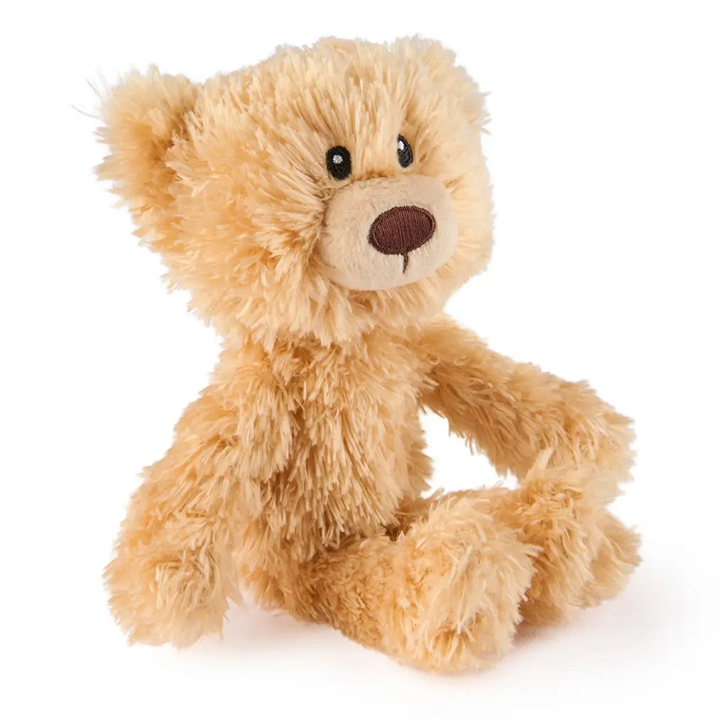 GUND Toothpick plush teddy bear in light tan textured fabric with soft rounded limbs and ears, angled seated position highlighting fluffy material, displayed on a clean white background