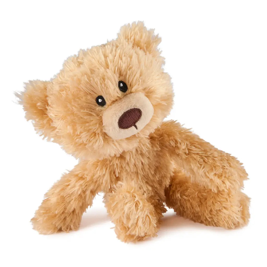 GUND Toothpick plush teddy bear in light tan fluffy fabric with flexible limbs and rounded shape, slightly reclined pose showing softness, small stuffed toy on a clean white background