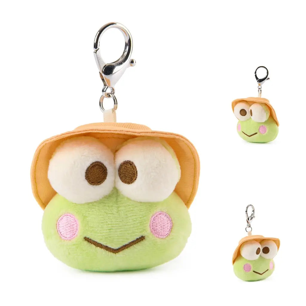 Keroppi plush keychain from GUND in light green velour fabric with smooth texture, wide rounded frog face, embroidered eyes and smile, tan camping hat, and silver clip, created as a small 3.5 inch surprise plush.