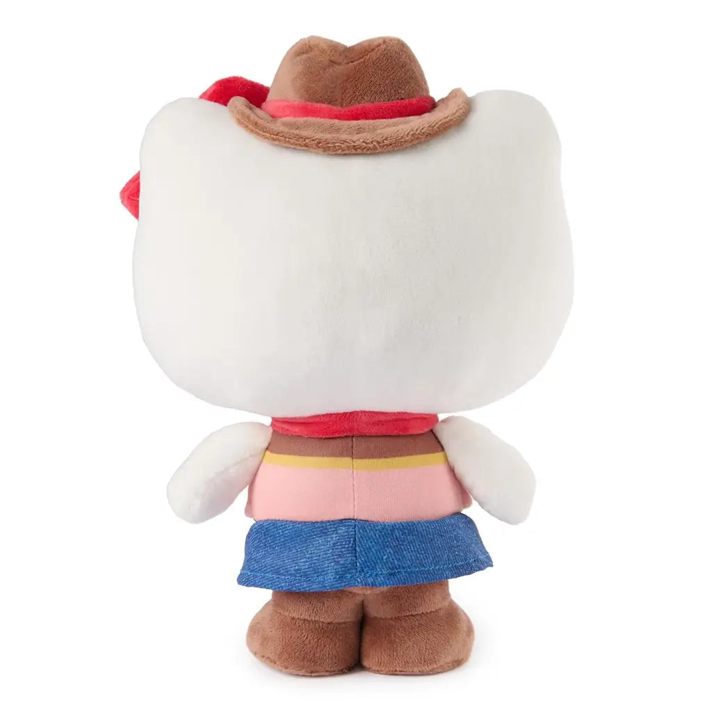 Hello Kitty cowgirl plush rear view by GUND showing white velour head, smooth fabric texture, brown cowboy hat from behind, pink vest and blue skirt detailing, and soft rounded plush construction on a white background.