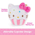 GUND Hello Kitty cupcake plush featuring an adorable cupcake design with white velour frosting texture, rounded form, pink striped baking cup base, colorful embroidered sprinkles, and signature pink bow, photographed on a clean white background.