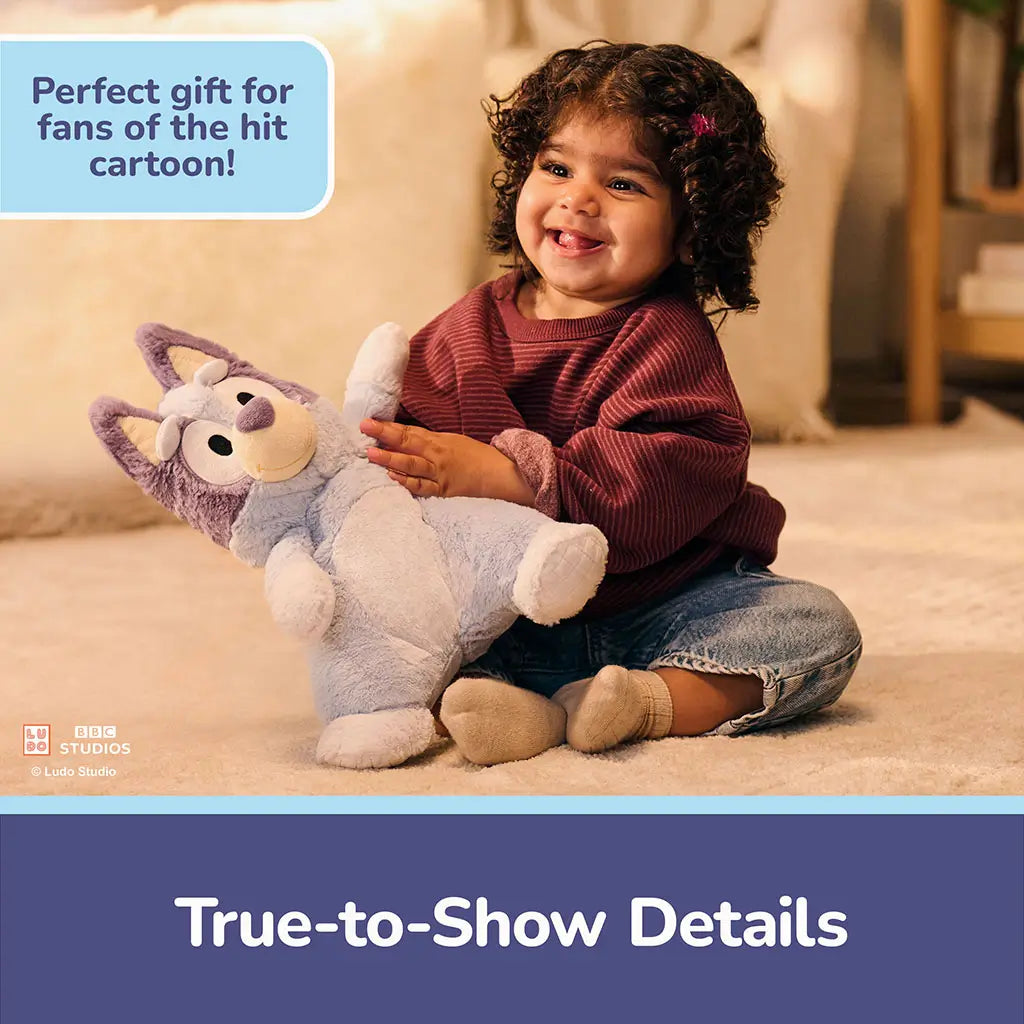 Bluey plush toy features soft light blue and lavender plush fabric, rounded under-stuffed body, embroidered eyes and smile, and quilted paw accents, designed for comforting cuddles in a cozy indoor setting.