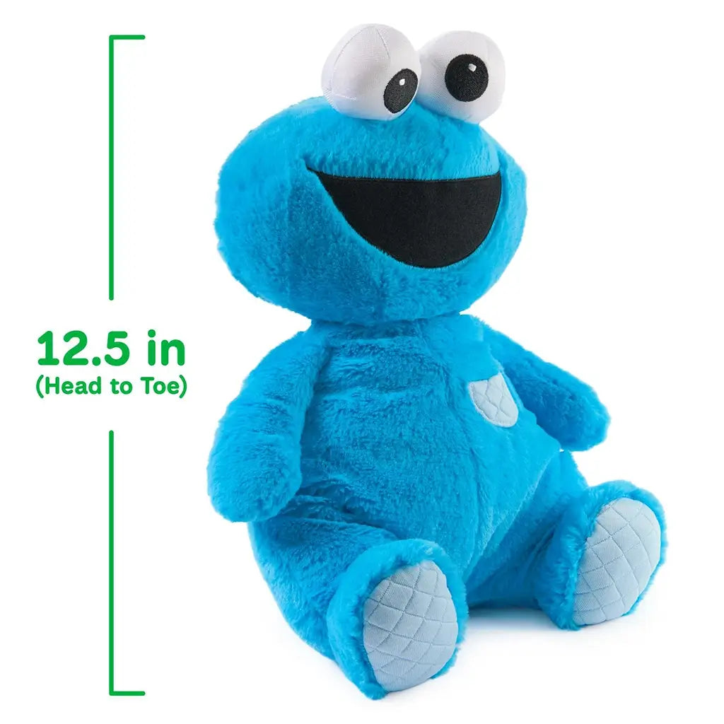 GUND Sesame Street Cookie Monster plush in bright blue jersey cotton with quilted foot pads and floppy arms, rounded huggable shape, shown with measurement graphic indicating 12.5-inch head-to-toe size on a clean white background.