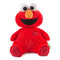 GUND Sesame Street Elmo plush in vibrant red soft jersey fabric with quilted foot pads, rounded seated shape, and friendly embroidered face, created for hugging and comfort, photographed upright against a clean white studio background.