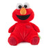 GUND Sesame Street Elmo plush in vibrant red soft jersey fabric with quilted foot pads, rounded seated shape, and friendly embroidered face, created for hugging and comfort, photographed upright against a clean white studio background.