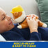 Paw Patrol Rubble plush toy in tan and cream soft fabric with yellow helmet and collar, small rounded bulldog shape designed for cuddling, held by child relaxing on couch indoors