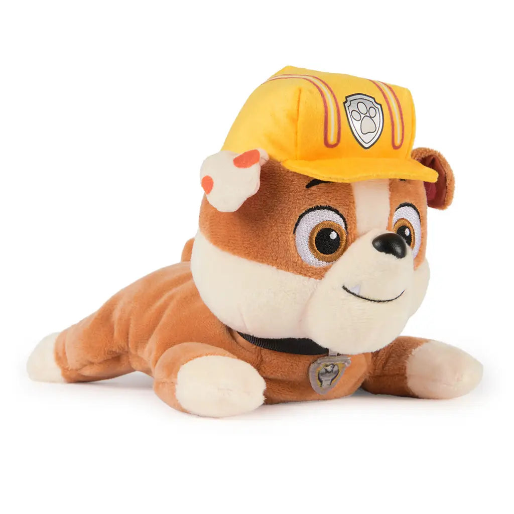 GUND Paw Patrol Rubble plush toy in tan, cream, and yellow soft fabric with helmet and collar, small rounded bulldog form designed for cuddling on a clean white background