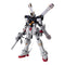 Gundam model kit white and navy plastic humanoid robot with angular armor and red feet, Crossbone Gundam X1 Ver Ka holding rifle with X-shaped backpack, displayed upright on clean white studio background
