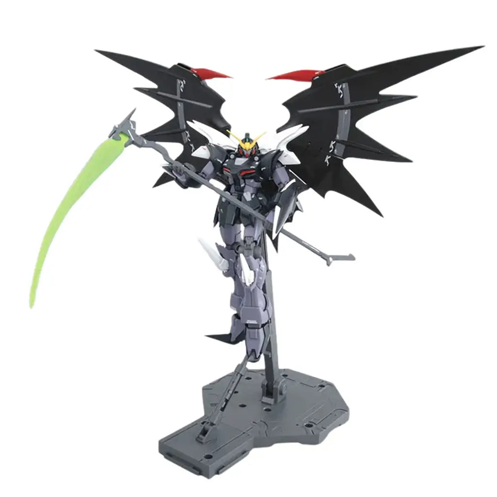 Bandai Gundam Deathscythe Hell model in black and gray plastic armor with red highlights, tall winged silhouette holding a long scythe weapon, balanced upright on a display base in a minimal white studio setting.