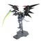 Bandai Gundam Deathscythe Hell model in black and gray plastic armor with red highlights, tall winged silhouette holding a long scythe weapon, balanced upright on a display base in a minimal white studio setting.