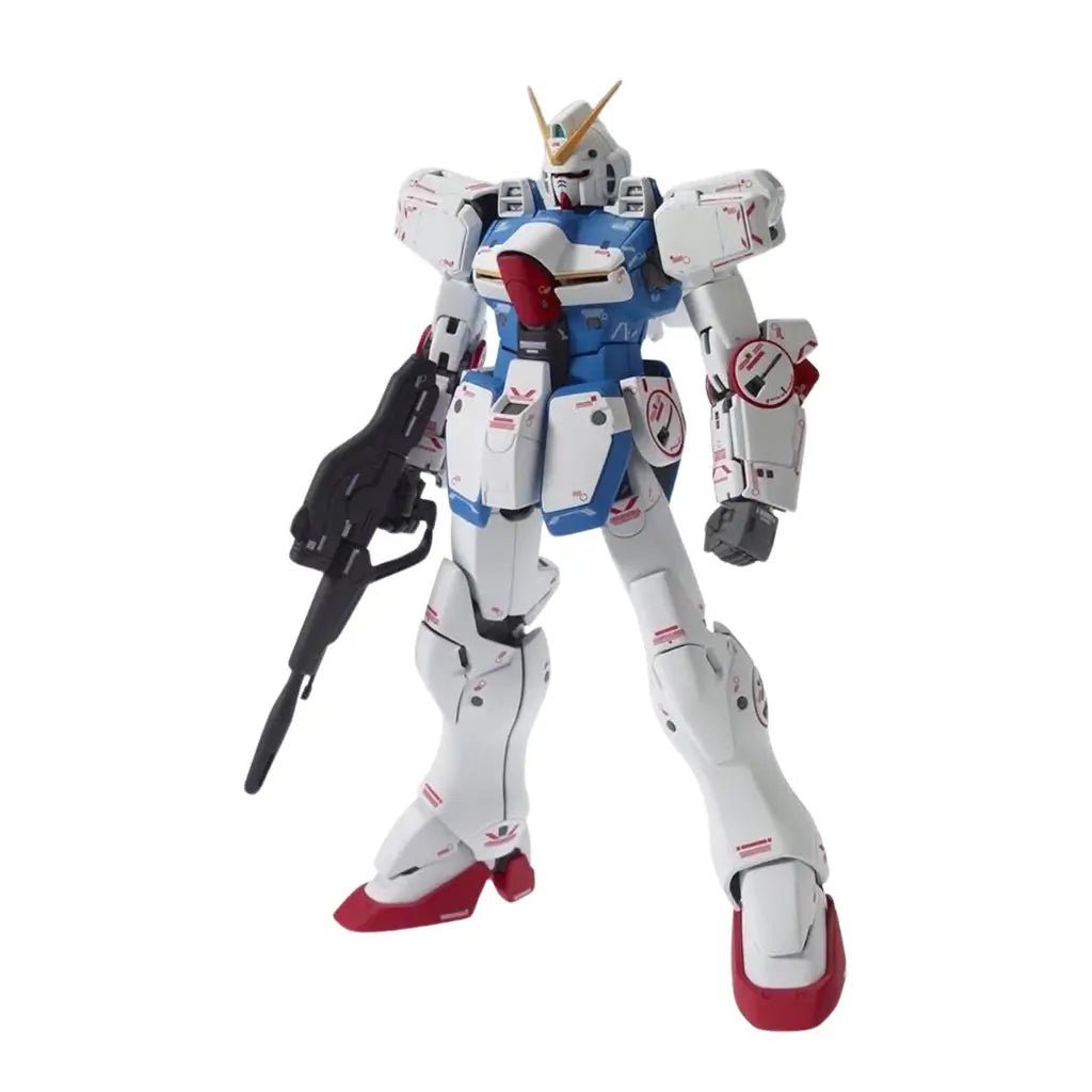 Bandai Victory Gundam model kit in white, blue, and red plastic with humanoid robot form, holding rifle weapon, detailed panel lines and joints, poseable mecha figure displayed on a white background