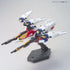 Bandai Wing Gundam Zero model kit in white, blue, red, and yellow plastic with jet mode form, featuring extended wings and mounted weapons, transforming mecha posed on a display stand against a neutral background