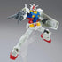 Gundam RX-78-2 model kit in white, blue, red, and yellow plastic with angular armor, posed mid-air holding a gray rifle and shield, displayed on a clear stand against a neutral gray studio background.