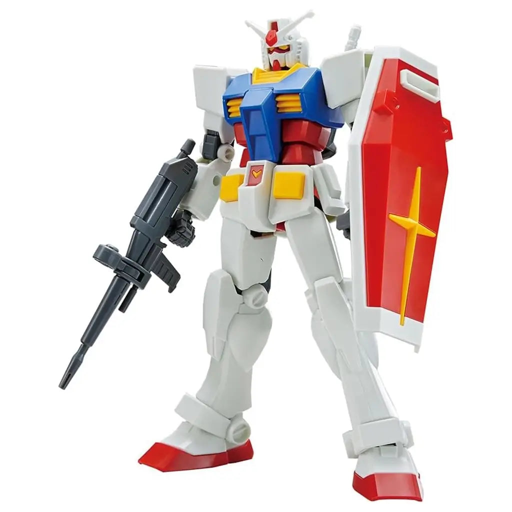 Gundam RX-78-2 figure in white, blue, red, and yellow plastic armor with sharp angular limbs, holding a gray beam rifle and red shield, posed standing on a seamless white background.