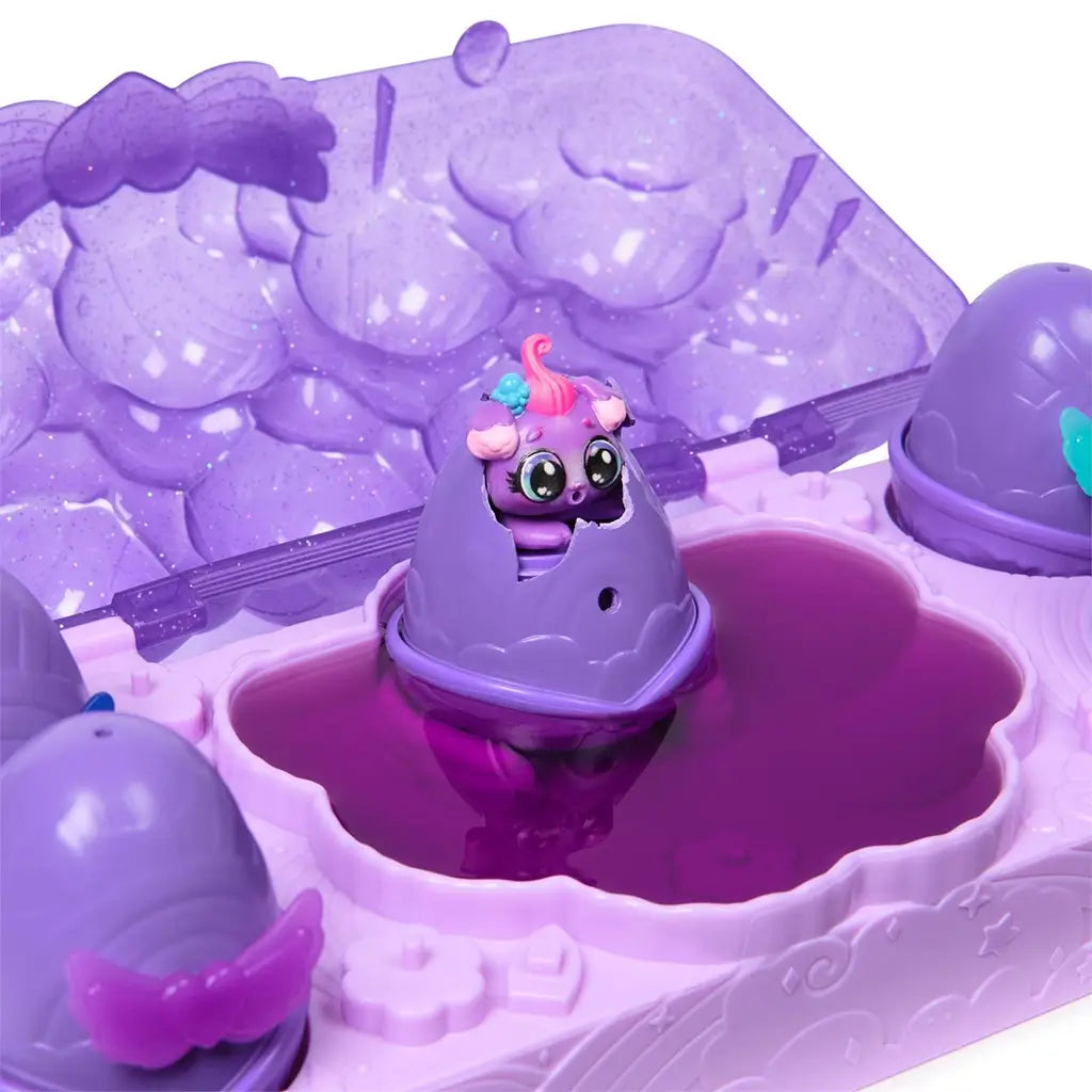 Purple Hatchimals Alive Neon Rainbow built-in hatching zone with translucent lid, molded cloud textures, and central color hatch pool where surprise characters emerge during interactive play.