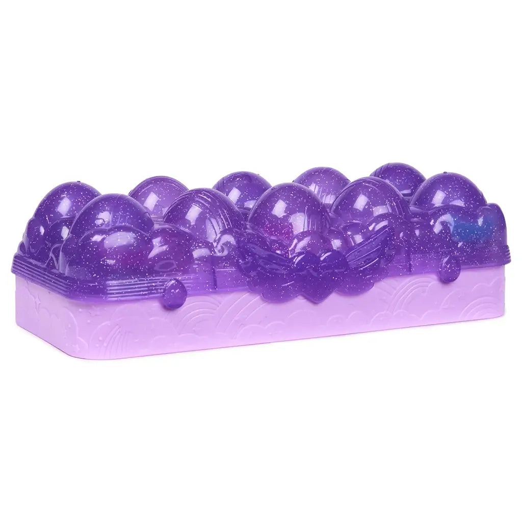 Purple Hatchimals Alive Neon Rainbow egg carton hatch zone opened to show multiple egg holders, pastel bow details, and molded compartments designed for repeated color reveal play.