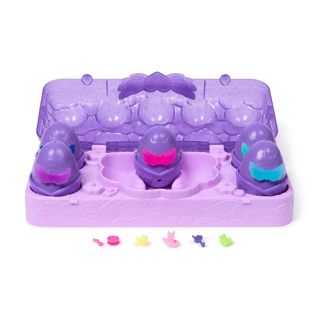 Hatchimals Alive Neon Rainbow egg carton set contents including purple carton base, multiple color hatch eggs, mini accessories, and bright neon characters laid out for imaginative play.