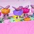 Hatchimals Bloomables close-up highlighting translucent butterfly wings, layered flower accessories, and smooth plastic textures as figures pop up from molded green tray inside the pink terrarium playset.