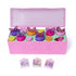Hatchimals Bloomables Bloom Bash playset opened to reveal pink plastic base, pastel flower decorations, collectible mini figures, and interactive elements arranged to create a whimsical garden party display.
