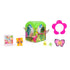 Hatchimals Bloomables surprise pack contents arranged on white background, including green blind box container, small collectible character, tiny accessories, decorative flower piece, and illustrated collector card.