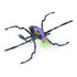 HEX BOTS Skitter Bot spider toy in purple and neon green molded plastic with eight black articulated legs and red eye details, posed in an angled view on a clean white studio background.