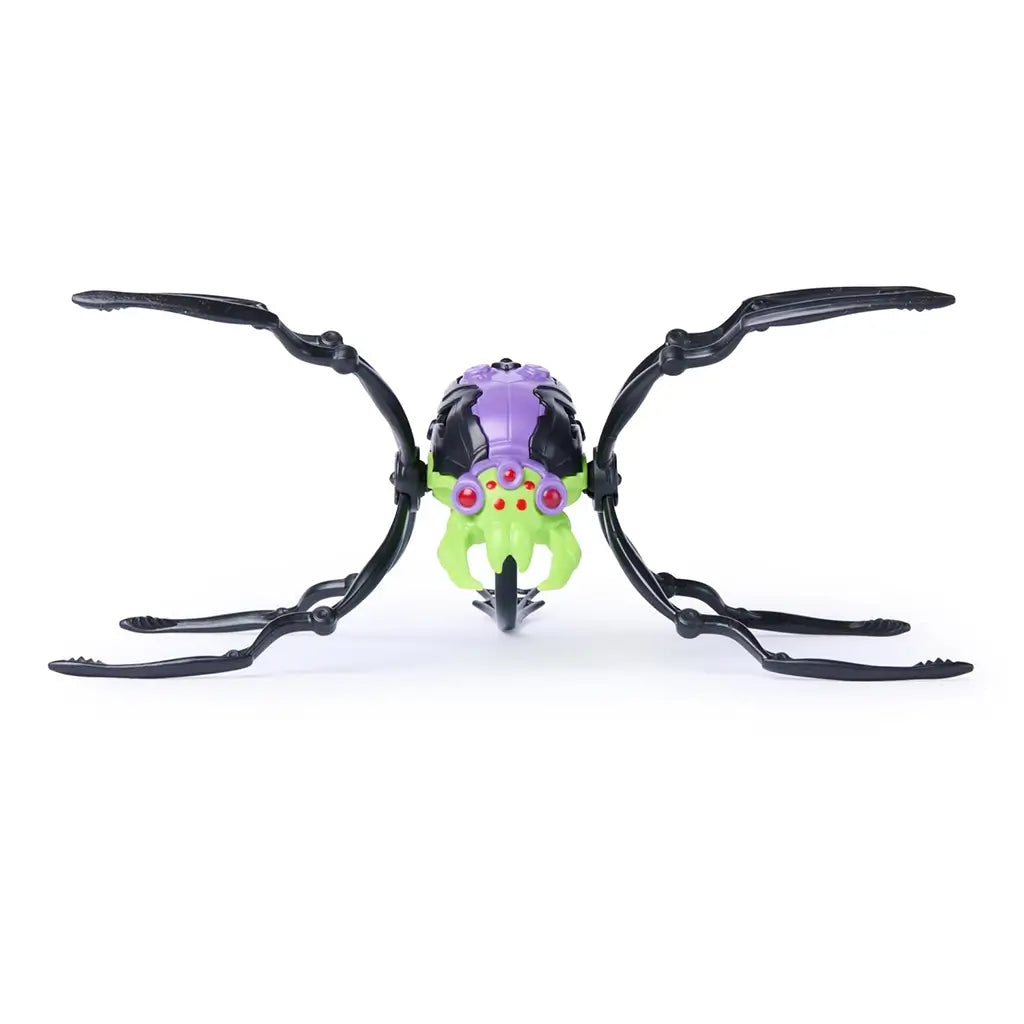 HEX BOTS Skitter Bot spider in purple and bright green molded plastic with curved black legs, red sensor eyes, and fang-like pincers, centered in a front view against a white background.